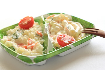 potato salad in food container for picnic food image