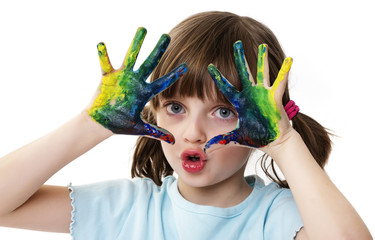 happy little girl playing with water colors