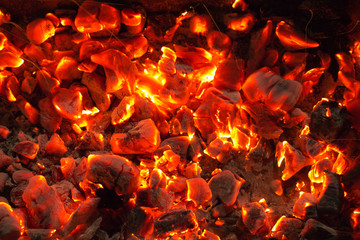burning charcoal in the background