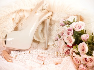 The bridal shoe, flowers and wedding rings with banner add