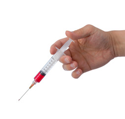 Hand holding syringe filled with red liquid.