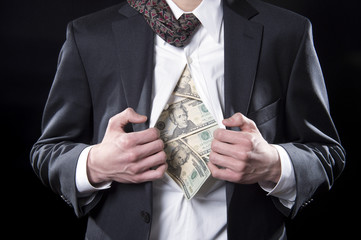 Concept businessman pulling back his shirt exposing money