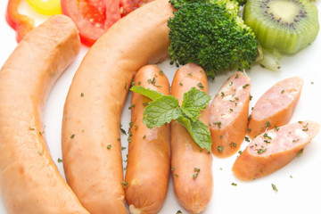Smoked sausages and cheese sausages with vegetable