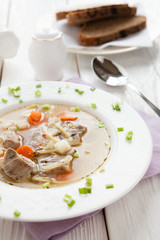 soup with chunks of beef and noodles