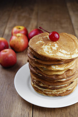 Pile of pancakes in the white plate