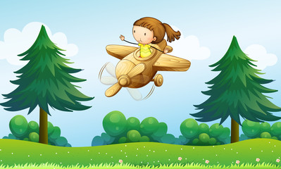 Een houten vliegtuig met een jong meisje