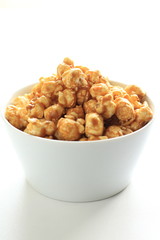 caramel popcorn in white bowl