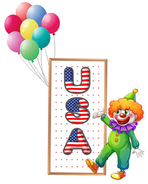 A clown beside the framed USA letters