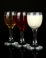 Tasty color liquors, isolated on black