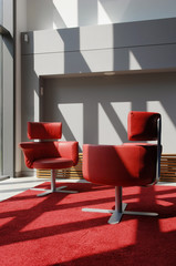 Two Red Seats In A Meeting Room