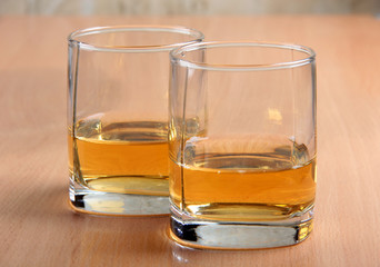 Whiskey glasses on wood