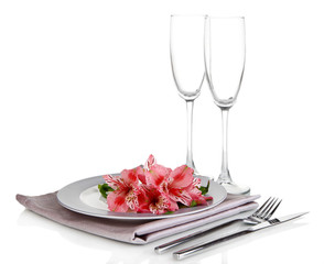 Festive table setting with flowers isolated on white