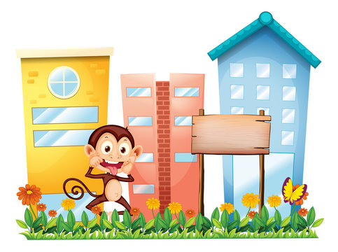 A monkey in the garden with a wooden signboard