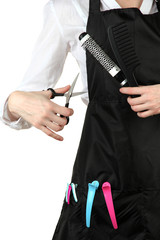 Hairdresser in uniform with working tools, isolated on white