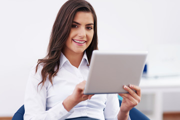 Smiling businesswoman using a digital tablet