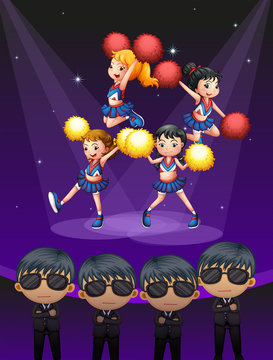 Four cheerdancers dancing with spotlights