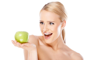 Happy and healthy woman holding apple