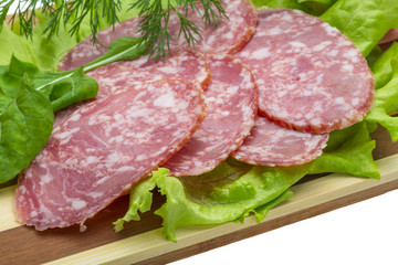 Sausages with salad and basil