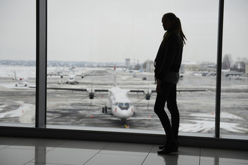 Woman standing in the airport terminal