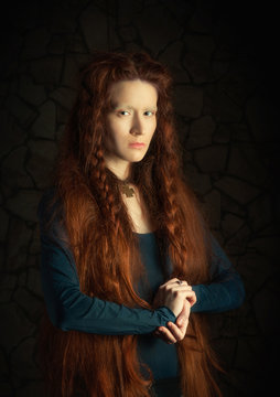 Portrait of woman with long red hair stylized as old picture