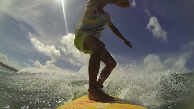Professional surfer rides a tropical ocean wave
