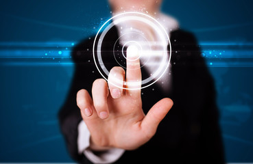 Woman pressing high tech type of modern buttons