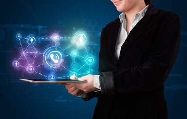 Woman showing social networking technology with colorful lights