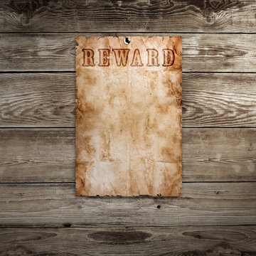 Old western wanted poster on wooden background