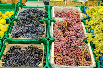 Colorful Display Of Grapes In A Market