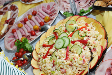 platters of ham, cheese, salad