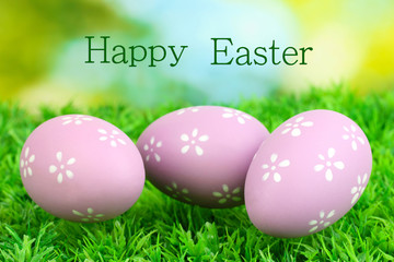 Colorful easter eggs on grass