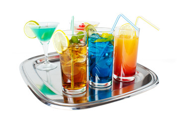 Different alcoholic beverages on tray , isolated