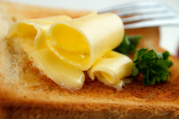 Butter rolls closeup on toasted bread, shallow dof