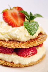 Sweet dessert - wafers with vanilla creme and strawberries