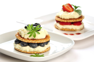 Sweet dessert - wafers with vanilla creme and strawberries