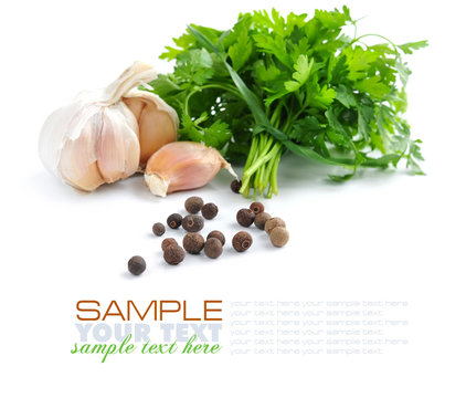 Grains of pepper are with a garlic and greenery of parsley