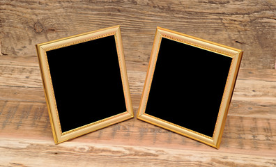 two blank photo frame on old table