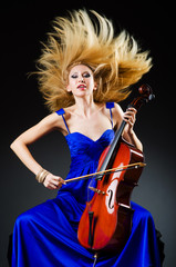 Attractive woman with cello in studio © Elnur