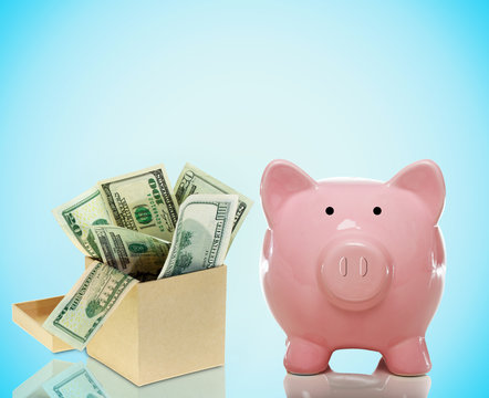 Piggy bank with a box of bills