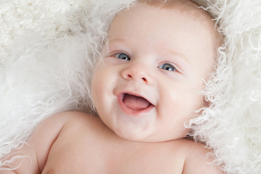 Portrait of a smiling baby close-up.