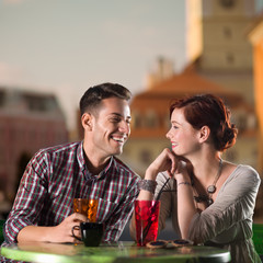 man and woman having a drink