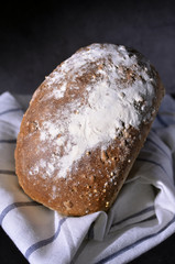 Flour dusted multi grain loaf of bread