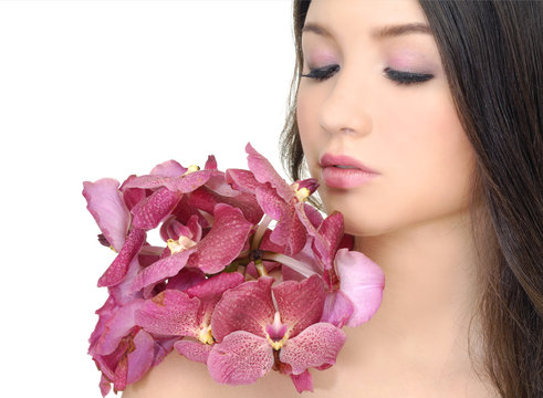 Close up portrait of girl holding bouquet orchid