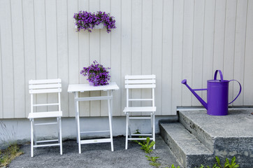 Arrangement of chairs, table and flowers