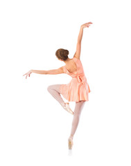 Young beautiful ballet dancer isolated over white background