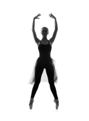 Balck silhouette of a young woman dancing ballet in a dress