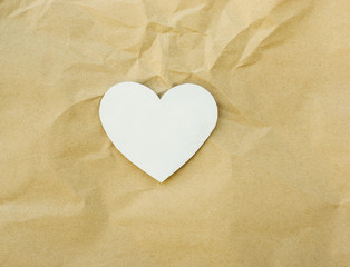 Fototapeta premium Heart paper on brown paper texture