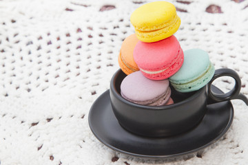 Pastel colorful macaroon,france  macaroon in coffee cup