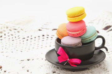Pastel colorful macaroon,france  macaroon in coffee cup