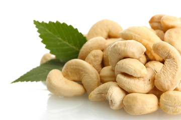 tasty cashew nuts with leaves, isolated on white